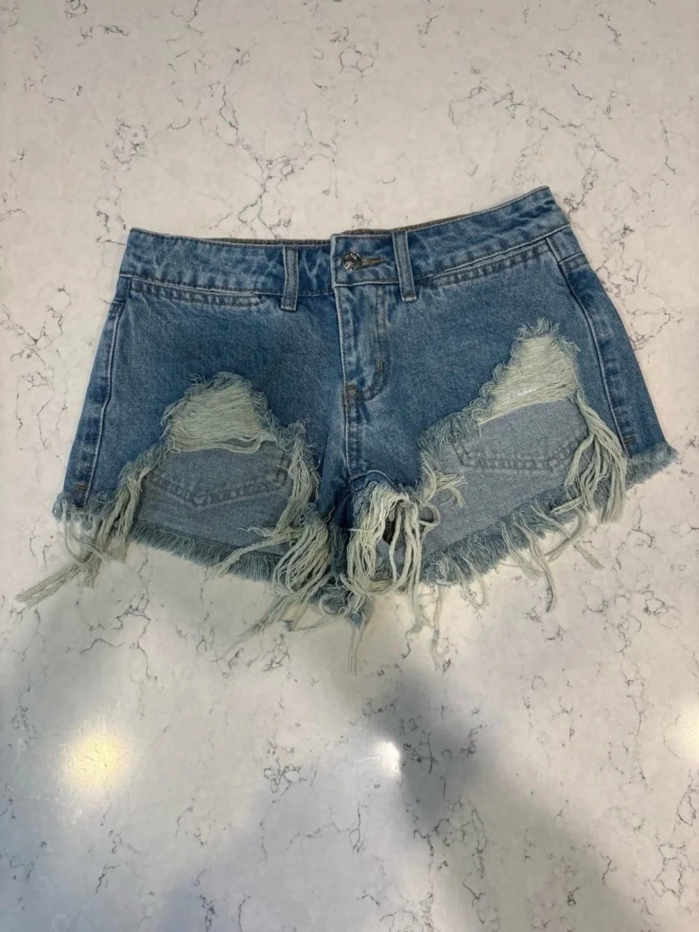 Edikted Distressed Light Blue Denim Cutoff Shorts